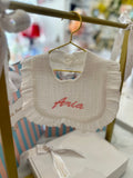 White frilly bib